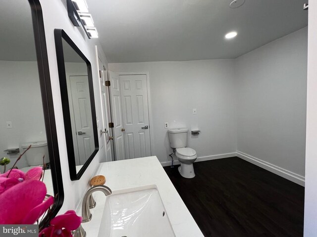 9872 Red Hill Rd, Spotsylvania, VA 22553 - bathroom featuring wood finished floors, vanity, and recessed lighting