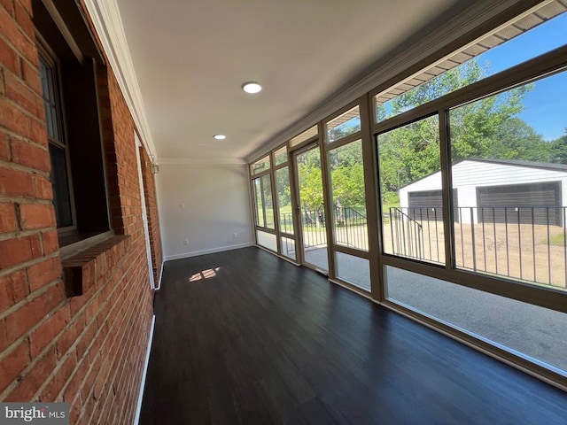 9872 Red Hill Rd, Spotsylvania, VA 22553 - unfurnished sunroom with ornamental molding, healthy amount of natural light, brick wall, wood finished floors, and recessed lighting