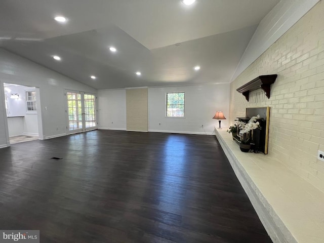 9872 Red Hill Rd, Spotsylvania, VA 22553 - unfurnished living room with vaulted ceiling, healthy amount of natural light, dark wood-style floors, a brick fireplace, and recessed lighting