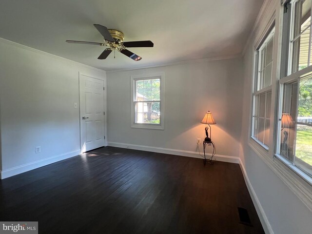 9872 Red Hill Rd, Spotsylvania, VA 22553 - spare room with dark wood-style floors, ornamental molding, and a ceiling fan