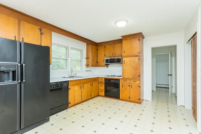 871 Kent Rd, Waynesboro, VA 22980 - kitchen with black appliances, light floors, light countertops, and brown cabinetry