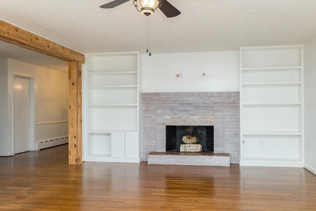871 Kent Rd, Waynesboro, VA 22980 - unfurnished living room featuring a textured ceiling, built in shelves, ceiling fan, wood finished floors, and a baseboard radiator