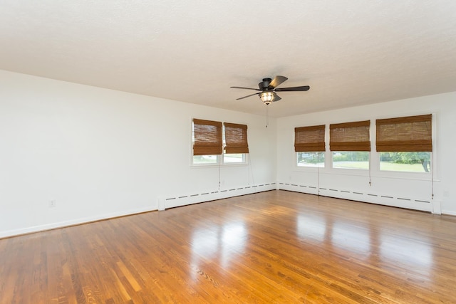 871 Kent Rd, Waynesboro, VA 22980 - empty room with a ceiling fan, wood finished floors, and baseboard heating