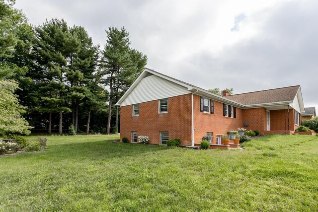 871 Kent Rd, Waynesboro, VA 22980 - view of side of home with brick siding, a chimney, and a yard