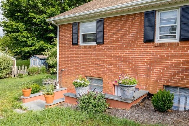 871 Kent Rd, Waynesboro, VA 22980 - view of side of home with brick siding, a shed, and roof with shingles