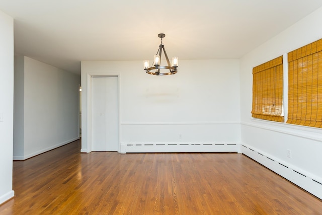 871 Kent Rd, Waynesboro, VA 22980 - spare room featuring a chandelier, wood finished floors, and a baseboard heating unit