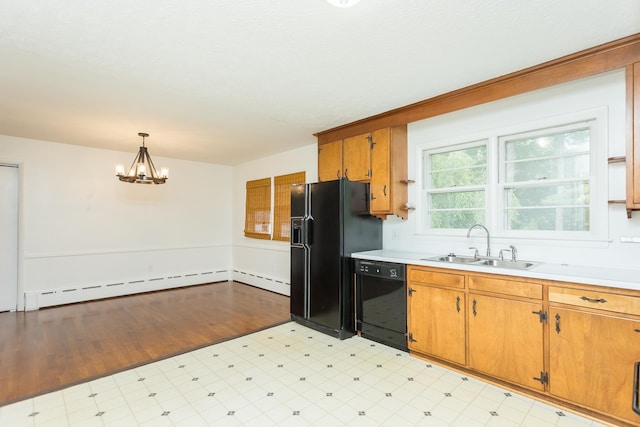 871 Kent Rd, Waynesboro, VA 22980 - kitchen featuring light countertops, black appliances, light floors, a chandelier, and brown cabinets
