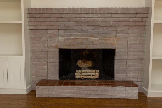871 Kent Rd, Waynesboro, VA 22980 - detailed view of wood finished floors, a brick fireplace, and built in shelves