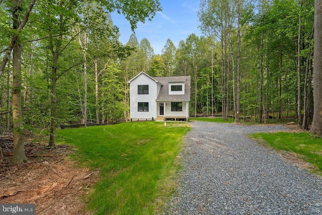 5831 Stubbs Bridge Rd, Mineral, VA 23117 - dutch colonial featuring a wooded view, a front yard, gravel driveway, and roof with shingles