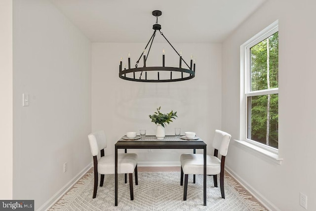 5831 Stubbs Bridge Rd, Mineral, VA 23117 - dining space with a chandelier, baseboards, and wood finished floors
