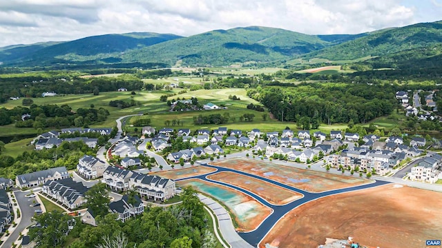 birds eye view of property featuring a mountain view