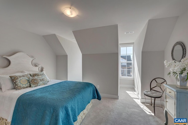 bedroom featuring light carpet, baseboards, and visible vents