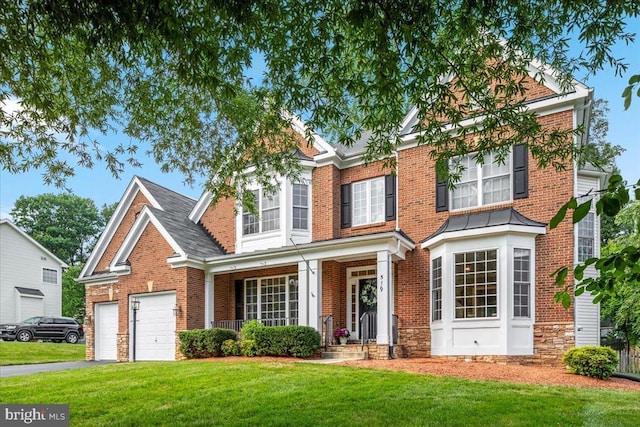519 Cardinal Ln, Warrenton, VA 20186 - traditional home with a front lawn, driveway, an attached garage, and brick siding