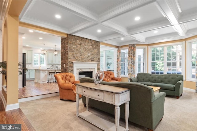 519 Cardinal Ln, Warrenton, VA 20186 - living room with beamed ceiling, crown molding, a stone fireplace, light wood-style floors, and recessed lighting