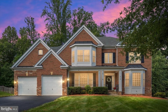 519 Cardinal Ln, Warrenton, VA 20186 - view of front of house featuring asphalt driveway, a porch, brick siding, and a garage