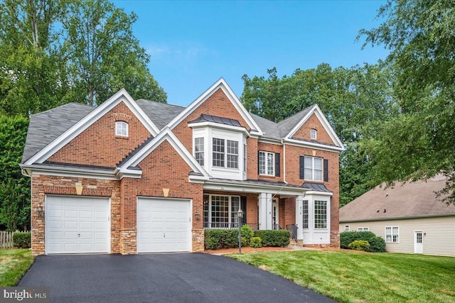 519 Cardinal Ln, Warrenton, VA 20186 - view of front of home with driveway, a front lawn, a porch, stone siding, and brick siding