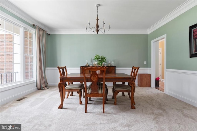 519 Cardinal Ln, Warrenton, VA 20186 - dining area featuring a chandelier, crown molding, and carpet flooring