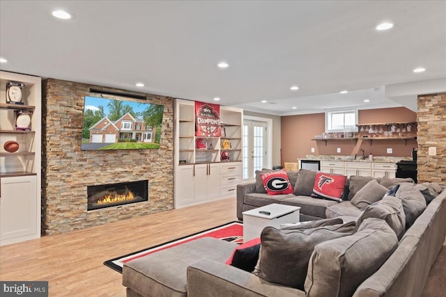 519 Cardinal Ln, Warrenton, VA 20186 - living room featuring wood finished floors, a fireplace, bar with sink, recessed lighting, and wine cooler