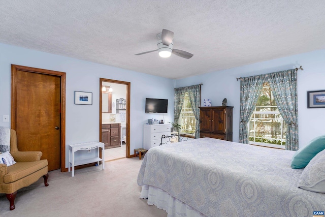 609 Jefferson Dr, Palmyra, VA 22963 - bedroom with light carpet, a textured ceiling, ensuite bathroom, and a ceiling fan
