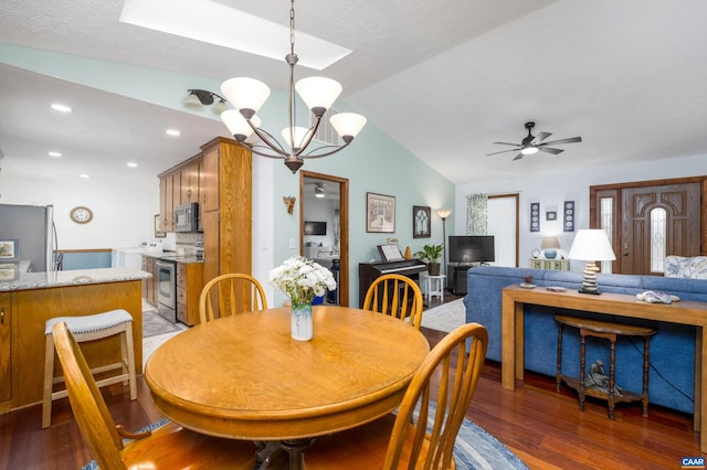 609 Jefferson Dr, Palmyra, VA 22963 - dining area featuring recessed lighting, ceiling fan with notable chandelier, vaulted ceiling with skylight, and light wood-style floors