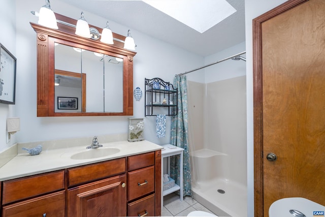 609 Jefferson Dr, Palmyra, VA 22963 - full bathroom with toilet, a shower stall, tile patterned floors, vanity, and a skylight