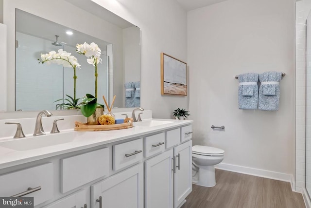 465 Baker Dr, Luray, VA 22835 - full bath with double vanity, toilet, wood finished floors, baseboards, and a shower