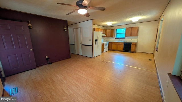 400 Laurel Dr, Madison, VA 22727 - kitchen with dishwasher, white fridge with ice dispenser, brown cabinets, light countertops, and light wood-style flooring