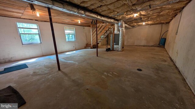 400 Laurel Dr, Madison, VA 22727 - below grade area with heating unit, concrete block wall, and stairs