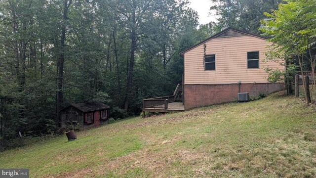 400 Laurel Dr, Madison, VA 22727 - view of green lawn with a storage unit and a deck