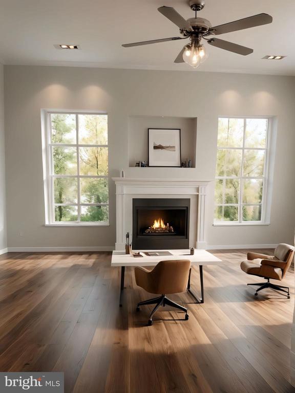 11206 Lynchburg Dr, Fredericksburg, VA 22407 - living area featuring a warm lit fireplace, wood finished floors, healthy amount of natural light, and a ceiling fan