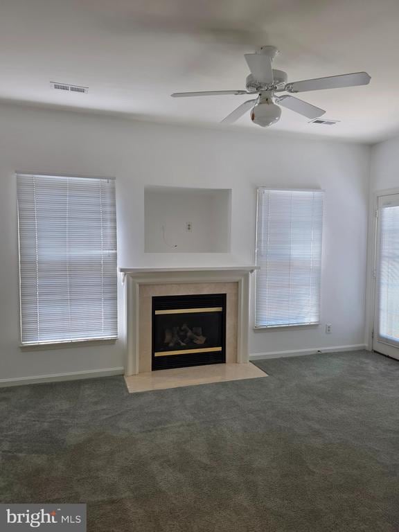 11206 Lynchburg Dr, Fredericksburg, VA 22407 - unfurnished living room featuring carpet floors, ceiling fan, and a glass covered fireplace