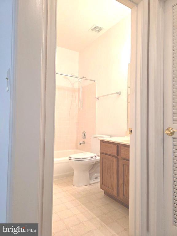 11206 Lynchburg Dr, Fredericksburg, VA 22407 - full bath featuring shower / bathtub combination, vanity, tile patterned floors, and a closet