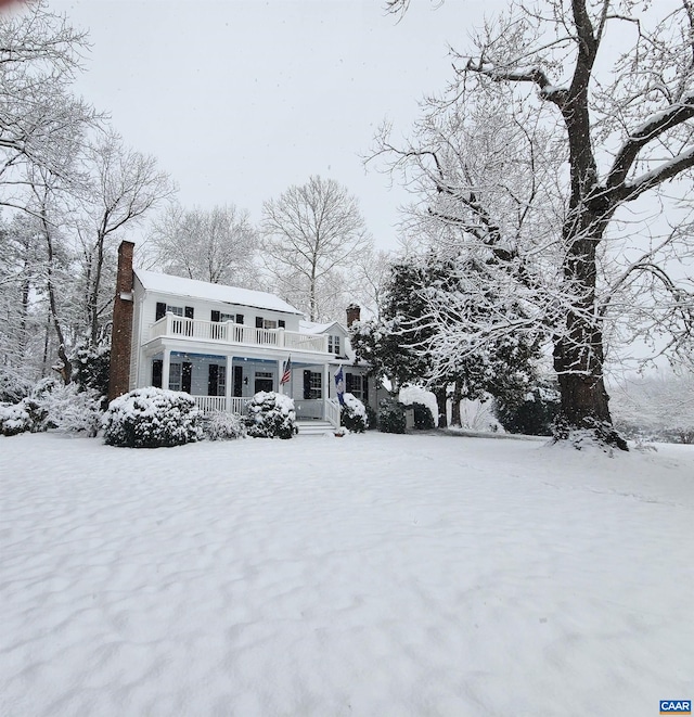 190 Perkins Rd, Kents Store, VA 23084 - view of front facade featuring a chimney, a balcony, and a porch