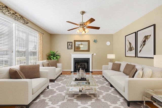 30 Sir Robin Rd, Waynesboro, VA 22980 - living room featuring a ceiling fan, wood finished floors, a fireplace with flush hearth, and baseboards