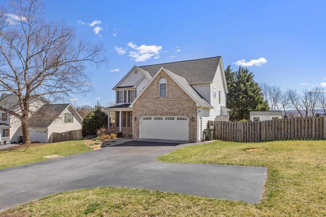 30 Sir Robin Rd, Waynesboro, VA 22980 - traditional home with asphalt driveway, brick siding, and a garage