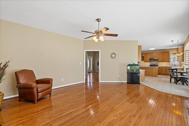 30 Sir Robin Rd, Waynesboro, VA 22980 - living room with light wood-style flooring, ceiling fan, and baseboards