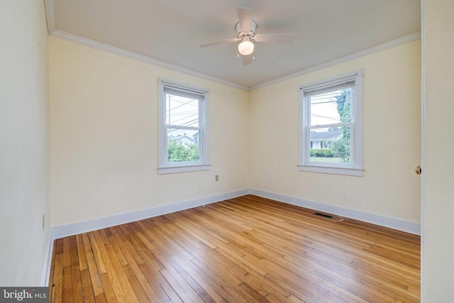 220 Mechanic St, Luray, VA 22835 - empty room with plenty of natural light, wood-type flooring, baseboards, crown molding, and ceiling fan