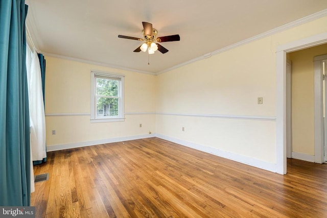 220 Mechanic St, Luray, VA 22835 - spare room with ceiling fan, wood finished floors, baseboards, and ornamental molding