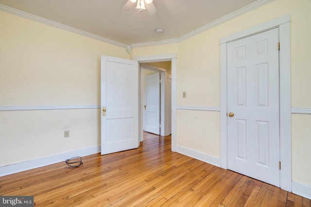 220 Mechanic St, Luray, VA 22835 - unfurnished bedroom featuring crown molding, light wood-style floors, baseboards, and ceiling fan