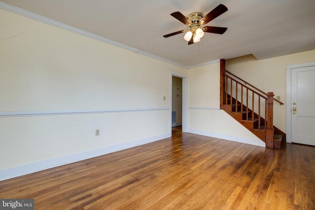220 Mechanic St, Luray, VA 22835 - unfurnished living room with stairway, wood finished floors, ceiling fan, baseboards, and crown molding