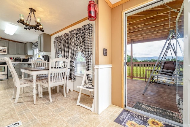 3930 Williams Ln, Elkton, VA 22827 - dining room with healthy amount of natural light, a chandelier, and crown molding