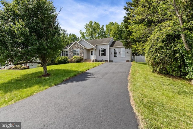 7306 Pullen Dr, Fredericksburg, VA 22407 - ranch-style house featuring asphalt driveway and a front yard