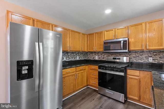 7306 Pullen Dr, Fredericksburg, VA 22407 - kitchen featuring appliances with stainless steel finishes, dark wood-type flooring, tasteful backsplash, and recessed lighting
