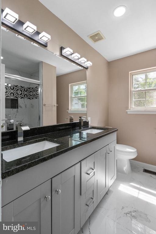 7306 Pullen Dr, Fredericksburg, VA 22407 - bathroom featuring double vanity, marble finish floors, toilet, a shower stall, and recessed lighting