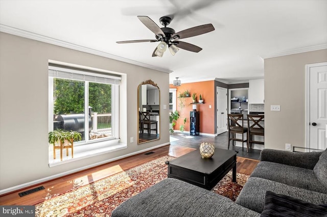 11814 Arbor Glen Dr, Fredericksburg, VA 22407 - living area featuring wood finished floors, crown molding, ceiling fan, and baseboards