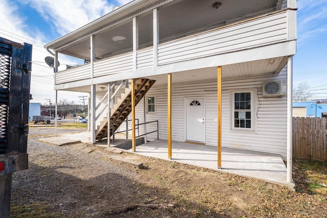 exterior space featuring stairway and fence