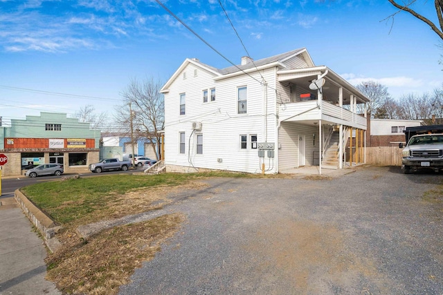 view of side of home with stairway
