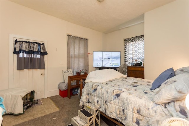 carpeted bedroom with baseboards