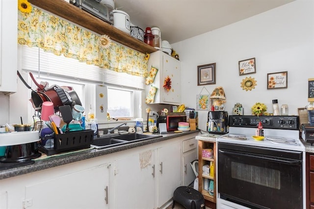 kitchen with open shelves, white cabinets, electric stove, and a sink