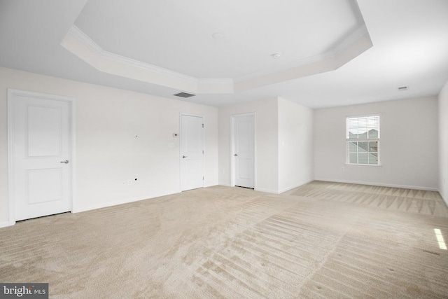 6056 Greenspring Rd, Fredericksburg, VA 22407 - empty room featuring a raised ceiling, light carpet, crown molding, and baseboards